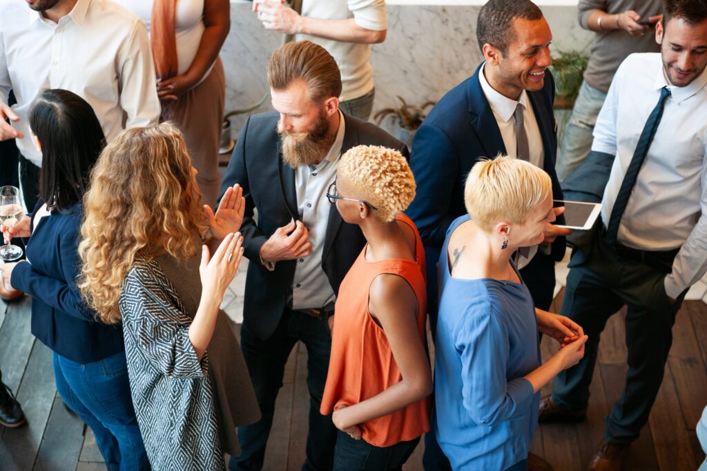 A group of professionals engaging in conversation at a field marketing event