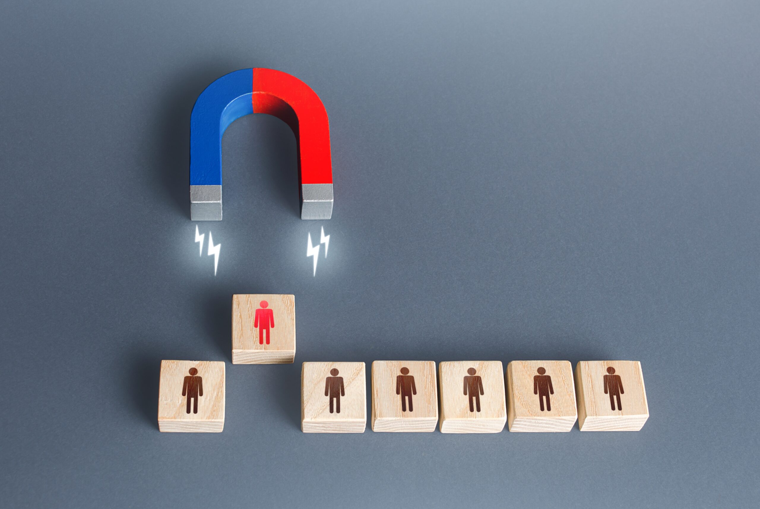 Customer icons drawn toward a magnet, representing scalable lead generation campaigns built to attract and convert.